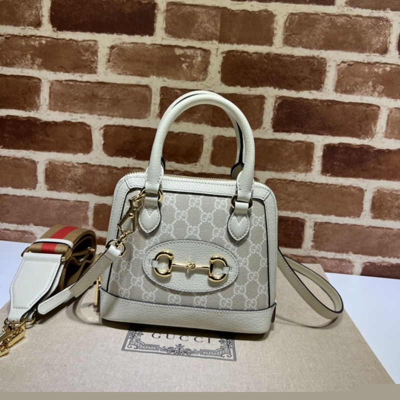 G*u*i top handle bags